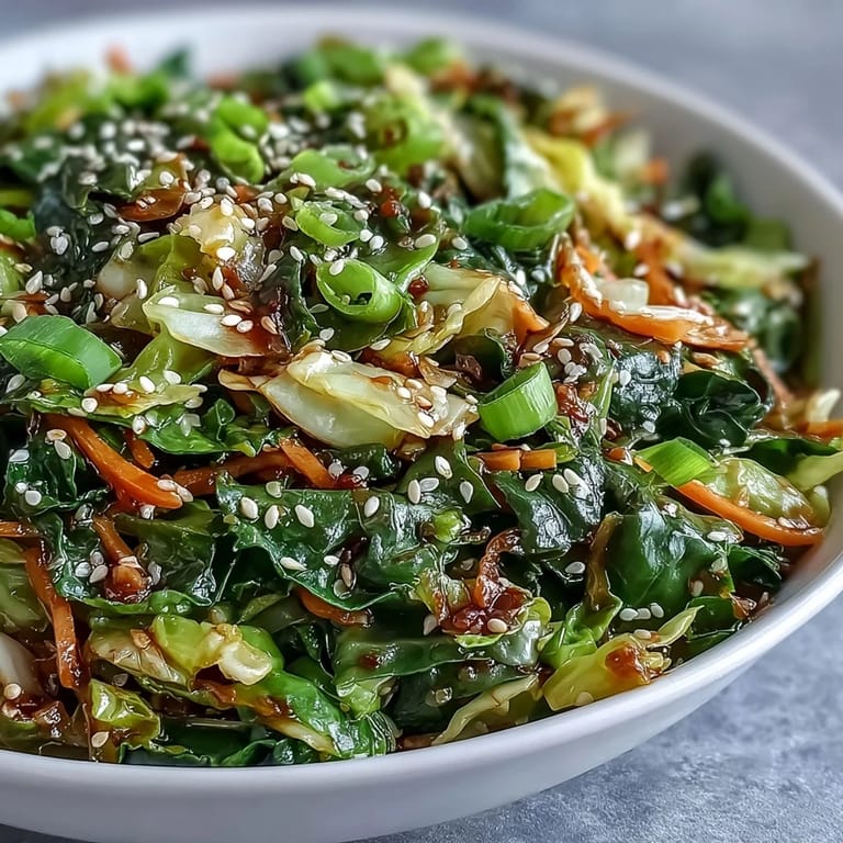 A steaming skillet of Hot and Sour Cabbage with julienned carrots and fresh scallions, ready for a weekday dinner.