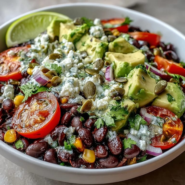 Colorful Black Bean and Veggie Bowl featuring corn, tomatoes, and a zesty lime dressing.