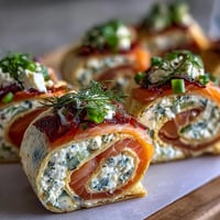 Elegant smoked salmon and cucumber cream cheese pinwheels rolled in soft tortillas, perfect for brunch or parties.